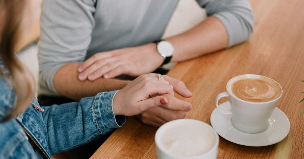 couple having a conversation over coffee